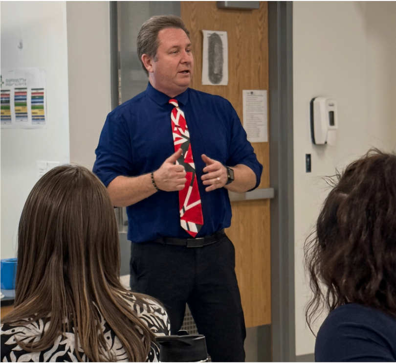 Erik M. Francis presenting to educators
